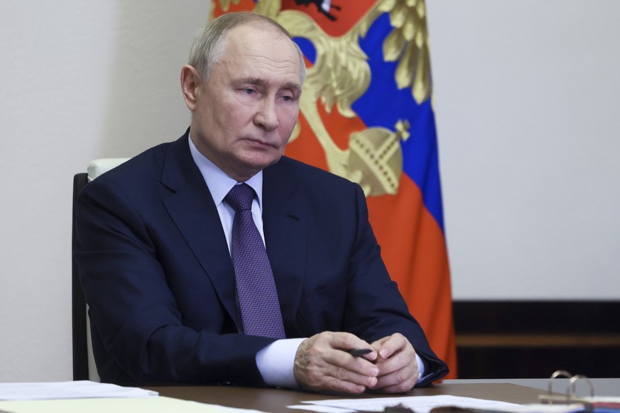 Russian President Vladimir Putin leads а cabinet meeting via videoconference at the Novo-Ogaryovo state residence, outside Moscow, Russia, Wednesday, Oct. 30, 2024. (Mikhail Metzel, Sputnik, Kremlin P ...