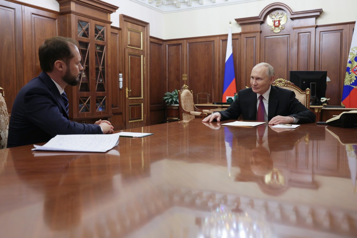 Russian President Vladimir Putin, right, listens to Deputy Head of the Federal Antimonopoly Service (FAS Russia) during their meeting at the Kremlin, on Tuesday, Nov. 4, 2025. (Gavriil Grigorov, Sputn ...