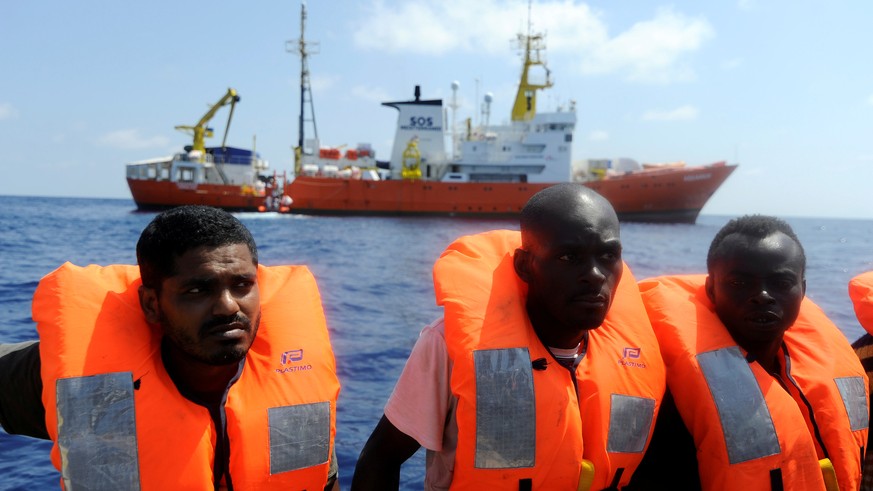 FILE PHOTO: Migrants are rescued by SOS Mediterranee organisation and Doctors Without Borders during a search and rescue (SAR) operation with the MV Aquarius rescue ship in the Mediterranean Sea, off  ...