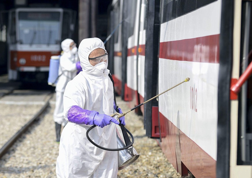 ©Kyodo/MAXPPP - 14/03/2020 ; Officials disinfect a streetcar in Pyongyang on Feb. 26, 2020, amid the coronavirus outbreak. (Kyodo) ==Kyodo