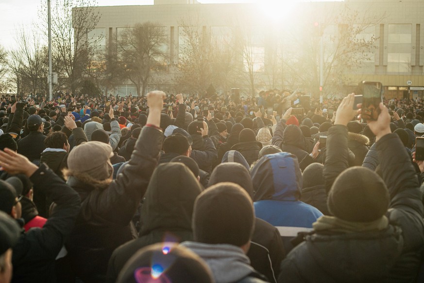 AKTAU, KAZAKHSTAN - JANUARY 4, 2022: People protest the liquefied petroleum gas price rise in Yntymak Square. The price that was raised on January 1, 2022, was lowered from $ 0.27 to 0.11 after a meet ...