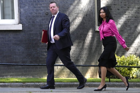 Britain's Lord President of the Council and Leader of the House of Commons Mark Spencer, left, and Britain's Attorney General Suella Braverman arrive for a cabinet meeting at 10 Downing Street in Lond ...