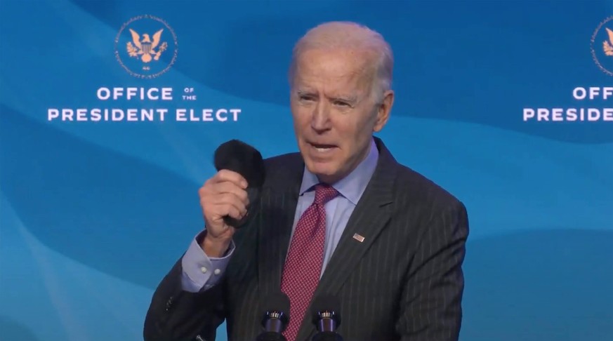 January 8, 2021, Wilmington, Delaware, USA: United States President-elect Joe Biden waves his mask as he takes questions from the press after making remarks introducing key members of his economic and ...