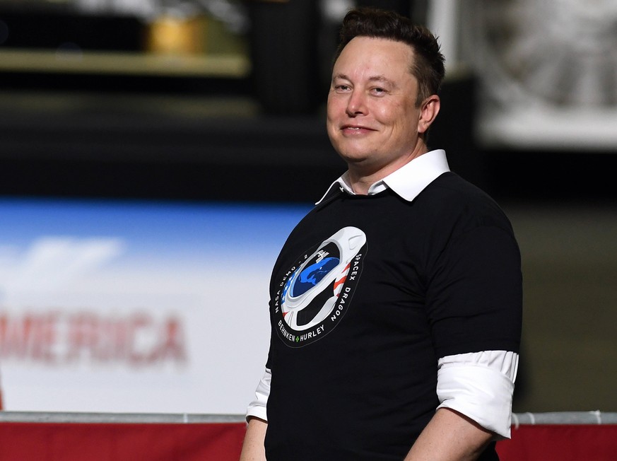May 30, 2020, Cape Canaveral, United States: SpaceX founder Elon Musk looks on after being recognized by U.S. President Donald Trump at NASA s Vehicle Assembly Building after watching the successful l ...