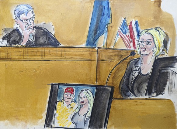 In this courtroom sketch, Stormy Daniels testifies on the witness stand as Judge Juan Merchan looks on in Manhattan criminal court, Tuesday, May 7, 2024, in New York.. A photo of Donald Trump and Dani ...