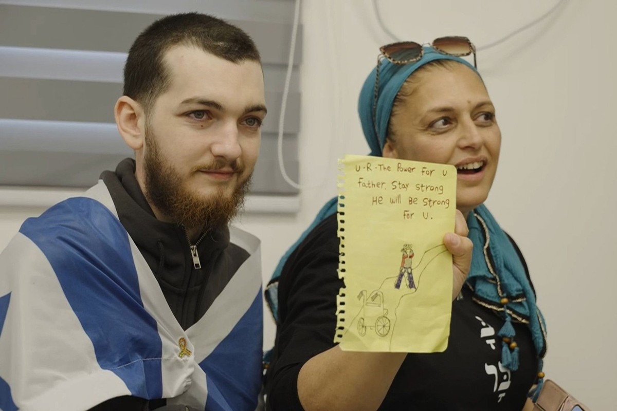 Bar Kupershtein, left, meets with his family after being released from Hamas captivity, on Monday, Oct. 13, 2025. (IDF via AP)
