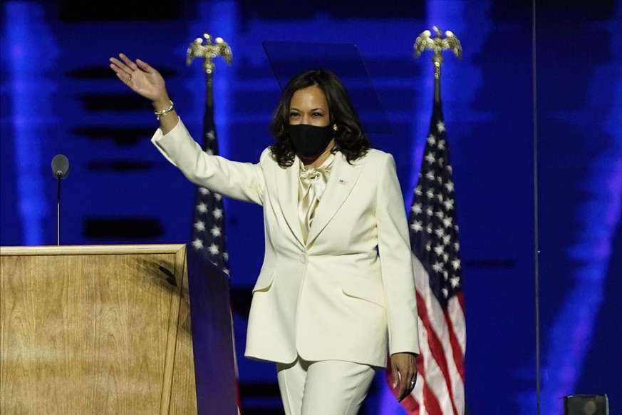 Vice President-elect Kamala Harris waves as she takes the stage before speaking, Saturday, November 7, 2020, in Wilmington, Delaware. Biden defeated President Donald Trump to become 46th president of  ...