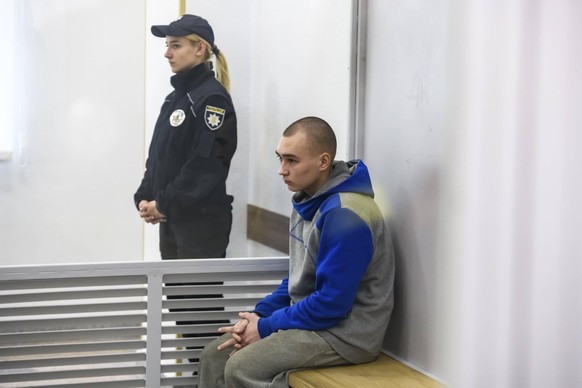 Russian Soldier Pleads Guilty In Kyiv Court On Charge Of Killing Civilian Russian soldier Vadim Shishimarin, 21, suspected of violations of the laws and norms of war, inside a cage during a court hear ...