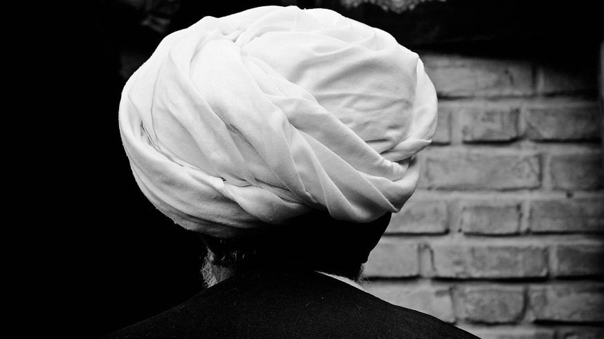 Dec. 5, 2011 - Khorramabad, Iran - Mullah from behind. Every year to mark the death of Imam Hussein, Shia Muslims mourn for two days. In Khorramabad and Lorestan in the west of Iran, during the first  ...
