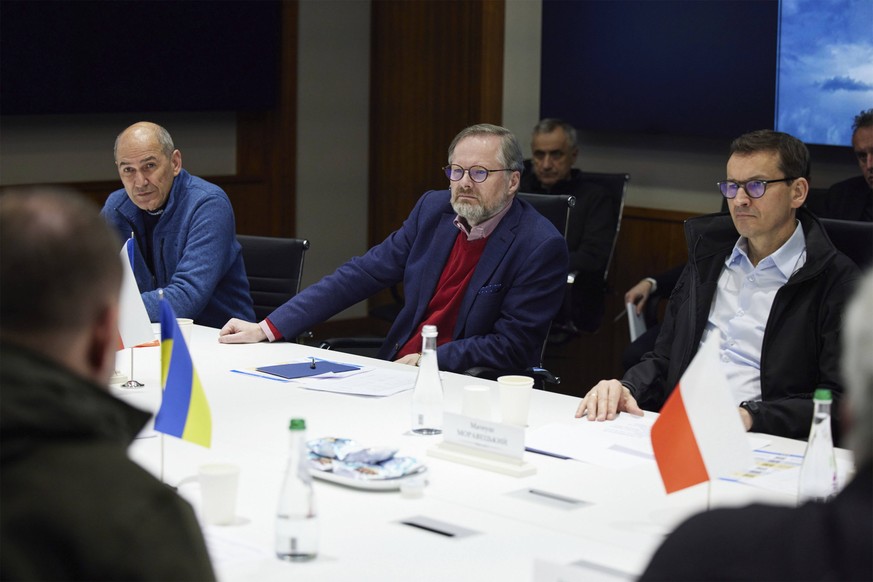 March 15, 2022, Kyiv, Ukraine: Slovenian Prime Minister Janez Jansa, left, Czech Prime Minister Petr Fiala, center, and Polish Prime Minister Mateusz Morawiecki listen during a face-to-face meeting wi ...
