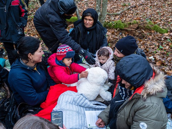 November 9, 2021, Narewka, Poland: Children seen playing with a toy provided by Grupa Granica organization..A refugee family of seventeen, including nine children from Dohuk, Iraq, spent seventeen day ...