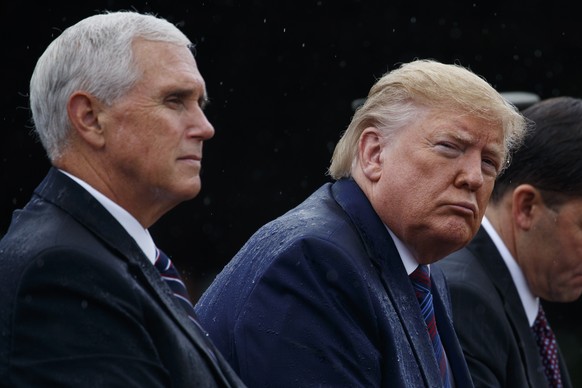 In this Sept. 30, 2019 photo, Vice President Mike Pence and President Donald Trump participate in an Armed Forces welcome ceremony for the new chairman of the Joint Chiefs of Staff, Gen. Mark Milley,  ...