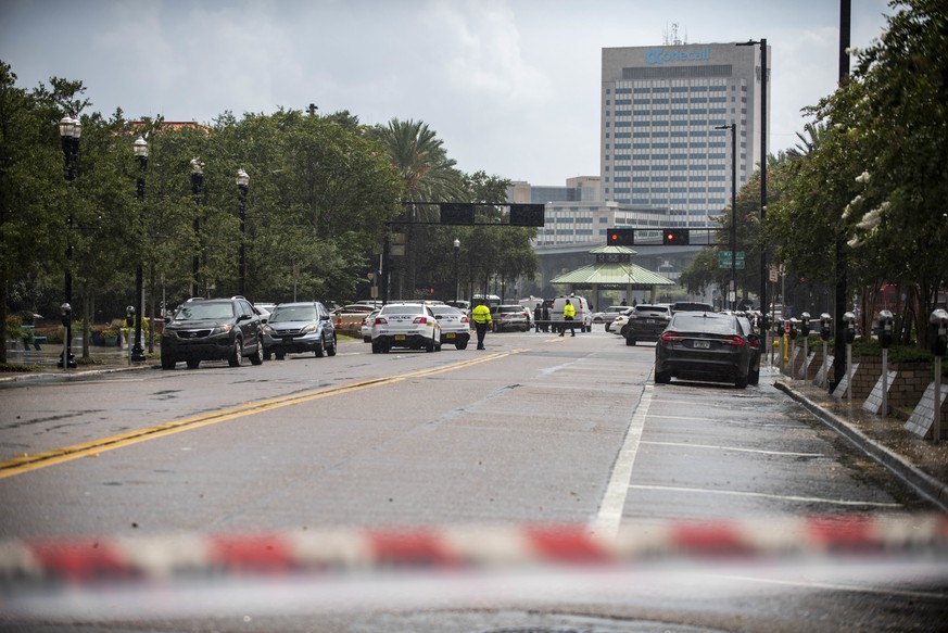 Police barricade a street near Jacksonville Landing in Jacksonville, Fla., Sunday, Aug. 26, 2018. Florida authorities are reporting multiple fatalities after a mass shooting at the riverfront mall in  ...