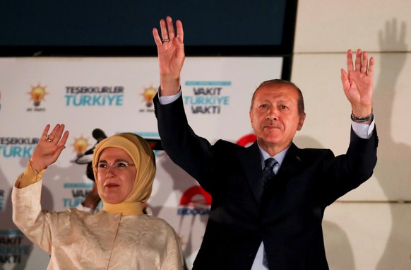 Turkish President Tayyip Erdogan and his wife Emine Erdogan greet supporters gathered in front of the AKP headquarters in Ankara, Turkey June 25, 2018. REUTERS/Umit Bektas TPX IMAGES OF THE DAY