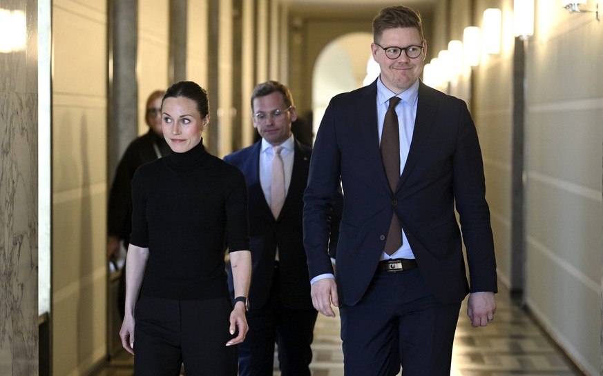 Social Democratic Party SDP chair, outgoing Prime Minister Sanna Marin, SDP parliamentary group Antti Lindtman R and party secretary Antton Rönnholm C after their meeting with National Coalition chair ...