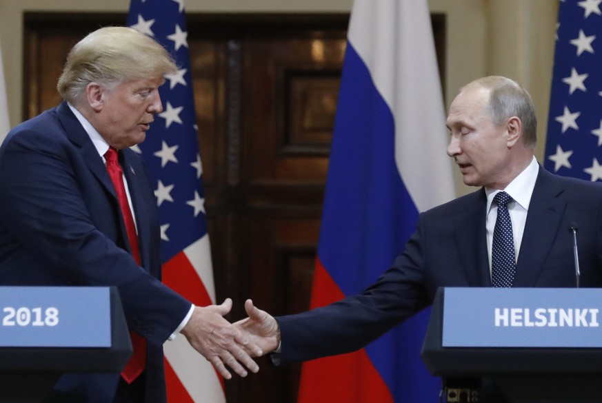 U.S. President Donald Trump, left, shakes hand with Russian President Vladimir Putin during a press conference after the meeting of U.S. President Donald Trump and Russian President Vladimir Putin at  ...