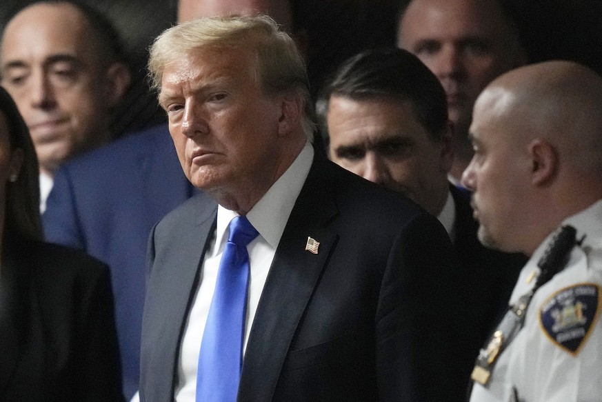 FILE - Former President Donald Trump walks out of the courtroom to make comments to members of the media after a jury convicted him of felony crimes for falsifying business records in a scheme to ille ...