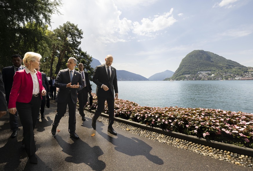 Swiss President Ignazio Cassis, Minister of Foreign Affairs, center, talks to Ursula Von der Leyen, President of the European Commission, left, and Ukrainian Prime Minister Denys Shmyhal, right, durin ...