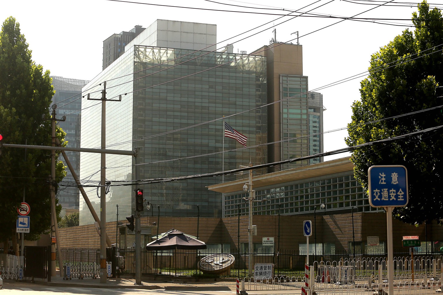 The American flag flies over the U.S. Embassy in Beijing, China on Friday, July 24, 2020. In retaliation for the Trump s administration s order for Beijing to close its consulate in Houston, China ord ...