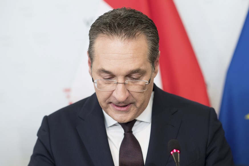 Austrian Vice Chancellor Heinz-Christian Strache (Austrian Freedom Party), center, addresses the media during press conference at the sport ministry in Vienna, Austria, Saturday, May 18, 2019. Strache ...