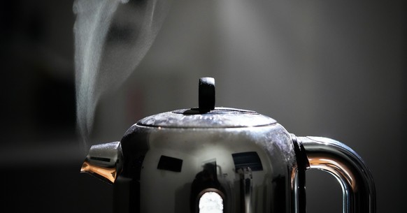 KNUTSFORD, UNITED KINGDOM - FEBRUARY 03: In this photo illustration a domestic electric kettle emits steam and vapour on February 07, 2022 in Knutsford, United Kingdom. The energy regulator OFGEM has ...