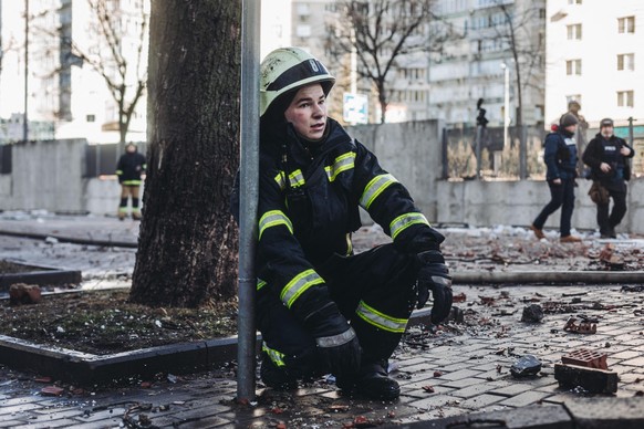 A firefighter in the vicinity of the bombed civilian building in a residential area on February 26, 2022, in Kiev, Ukraine. A missile has hit this residential building in the capital. The Ukrainian Mi ...