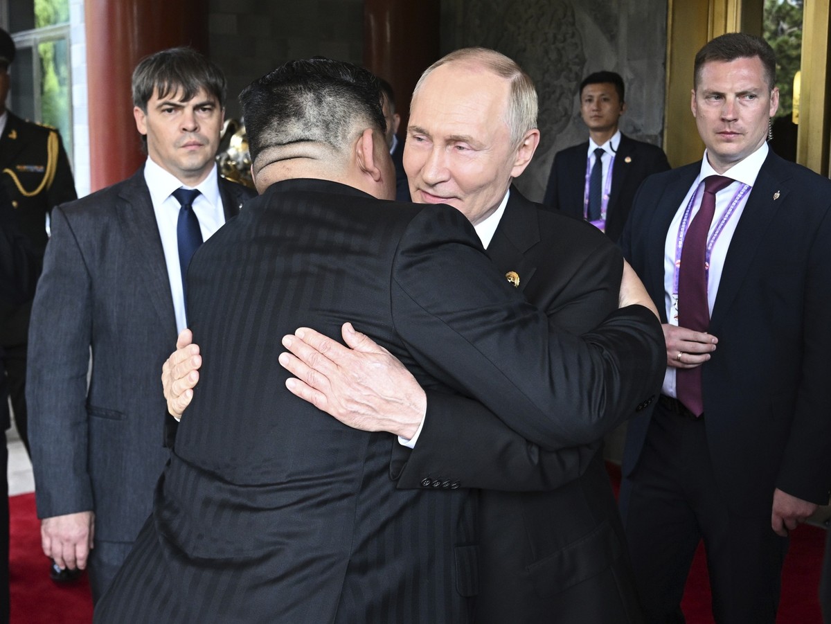 Russian President Vladimir Putin, center right, and North Korean leader Kim Jong Un hug each other after their meeting at Diaoyutai State Guesthouse in Beijing, China, Wednesday, Sept. 3, 2025. (Serge ...