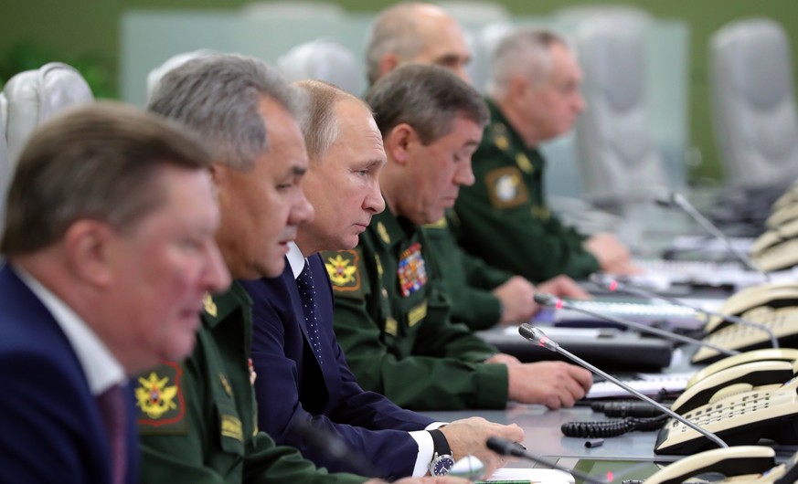 From the left, Sergei Ivanov, Russian special representative on questions of ecology and transport, Russian Defense Minister Sergei Shoigu, Russian President Vladimir Putin, and Chief of General Staff ...