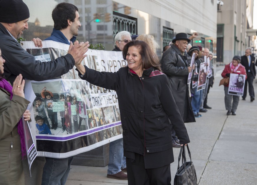 Nov. 5, 2014 - Detroit, Michigan, U.S. - Detroit, Michigan - Palestinian-American activist Rasmea Odeh, 67, greets supporters as she arrives at the Federal Courthouse for a trial that could imprison h ...