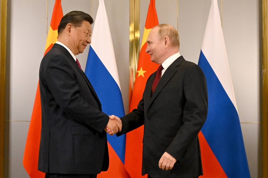 KAZAKHSTAN, ASTANA - JULY 3, 2024: China s President Xi Jinping and his Russian counterpart Vladimir Putin shake hands during a meeting on the sidelines of the 2024 SCO summit of heads of state. Serge ...