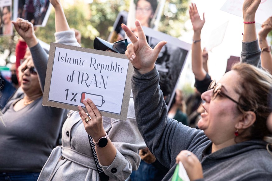 November 4, 2022, Istanbul, Turkey: Protester holds a placard during the demonstration. Protesters organized a demonstration following the death of Mahsa Amini. Mahsa fell into a coma and died after b ...