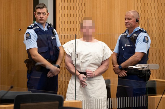 Brenton Tarrant, charged for murder, making a sign to the camera during his appearance in the Christchurch District Court, New Zealand March 16, 2019. Mark Mitchell/New Zealand Herald/Pool via REUTERS ...