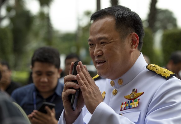 Thailand Minister of Public Health and leader of Bhumjaithai party Anutin Charnvirakul greets upon his arrival to attend a cabinet meeting at the Government House of Thailand in Bangkok, Thailand, Tue ...