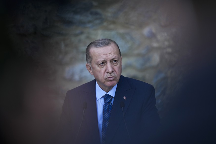 Turkey&#039;s President Recep Tayyip Erdogan listens to a question during a joint news conference with German Chancellor Angela Merkel following their meeting at Huber Villa presidential palace, in Is ...