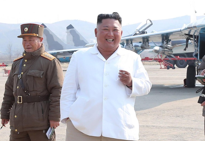 April 21, 2020: FILE: North Korean leader KIM JONG-UN R inspects a pursuit assault plane group under the Air and Anti-Aircraft Division in the western area in this file photo released April 12, 2020,  ...