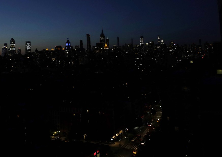 The Empire State Building along with other structures in Manhattan are dark due to a massive power outage In Midtown, Times Square, and other sections of Manhattan on Saturday July 13, 2019 in New Yor ...