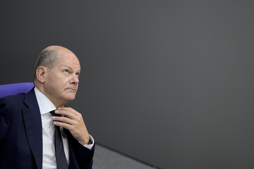 German Chancellor Olaf Scholz listens to the debate after his speech at the German parliament Bundestag ahead of a European Council meeting, at the Reichstag Building in Berlin, Germany, Thursday, Jun ...