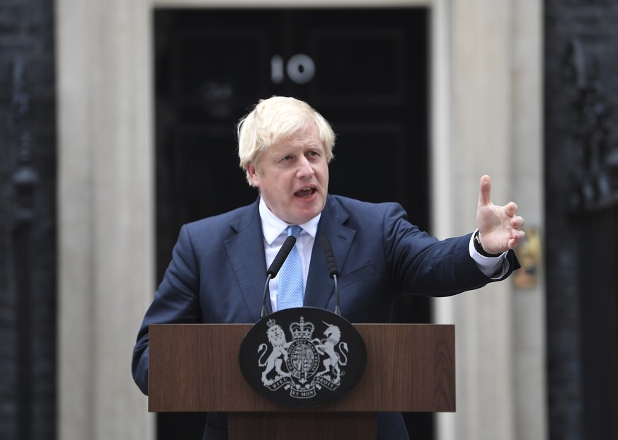 Britain's Prime Minister Boris Johnson speaks to the media outside 10 Downing Street in London, Monday, Sept. 2, 2019. Johnson says chances of a Brexit deal are rising (Victoria Jones/PA via AP)