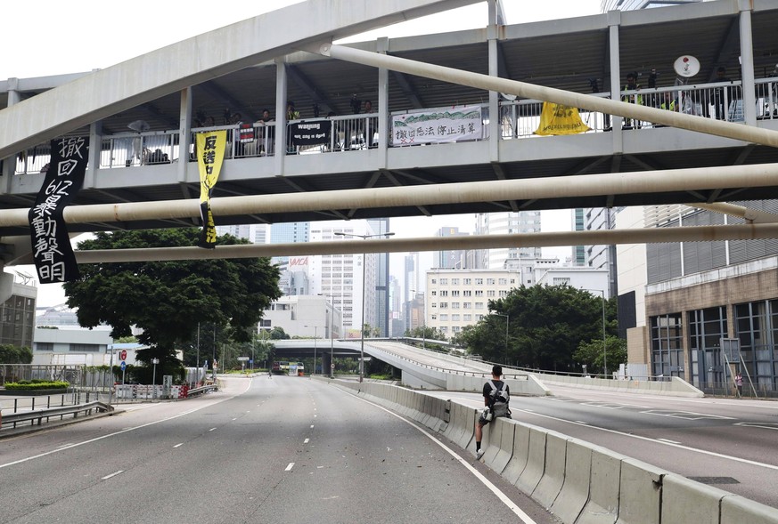 Hong Kong extradition bill protest Photo taken June 17, 2019, shows empty roads in central Hong Kong after demonstrators were cleared following a rally in which they demanded the resignation of pro-Be ...