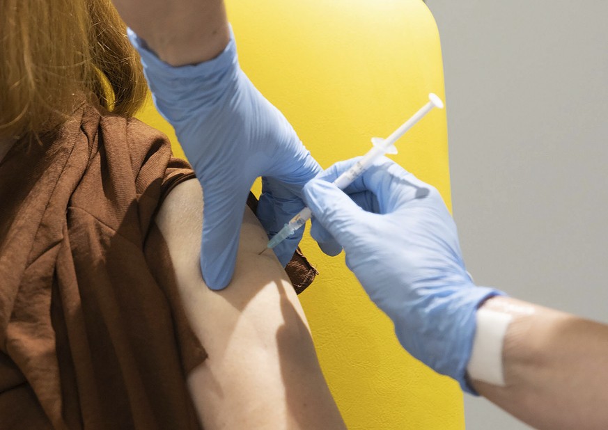 FILE - In this undated file photo issued by the University of Oxford, a volunteer is administered the coronavirus vaccine developed by AstraZeneca and Oxford University, in Oxford, England. New result ...