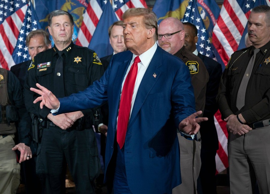 Syndication: Detroit Free Press Donald Trump waves good bye to a crowd of supporters after speaking at a press conference in the Monroe Meeting Rooms at DeVos Place in Grand Rapids on Tuesday, April 2 ...