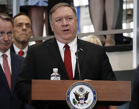 Secretary of State Mike Pompeo announces a new 'ethos' statement as he addresses employees in the lobby staircase of the U.S. State Department headquarters in Washington, Friday, April 25, 2019. (AP P ...
