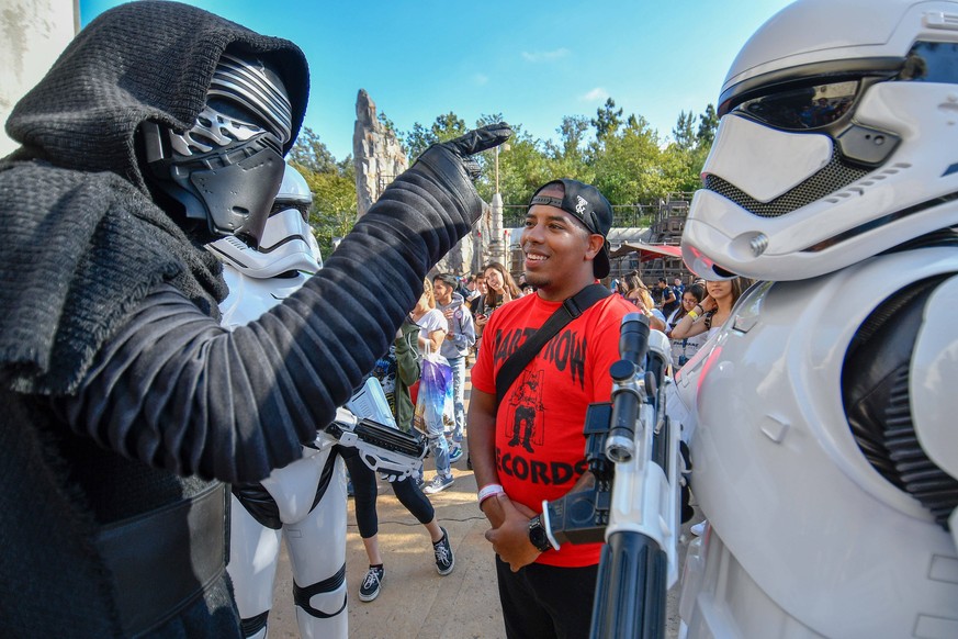 May 31, 2019 - Anaheim, California, U.S. - Greg Daniels is questioned by Kylo Ren and stormtroopers during at Black Spire Outpost on opening day at Star Wars: Galaxys Edge at Disneyland in Anaheim, CA ...