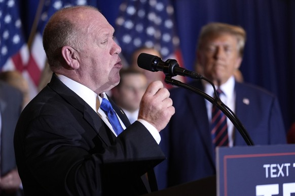 FILE - Tom Homan speaks as Republican presidential candidate former President Donald Trump listens at a primary election night party in Nashua, N.H., Jan. 23, 2024. President-elect Donald Trump says t ...