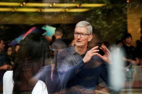 FILE PHOTO: Apple CEO Tim Cook attends an Apple store in Shanghai, China October 9, 2018. REUTERS/Aly Song/File Photo
