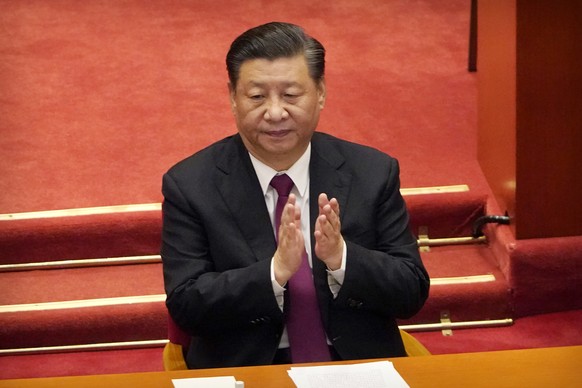 FILE - Chinese President Xi Jinping applauds during the closing session of the Chinese People's Political Consultative Conference (CPPCC) at the Great Hall of the People in Beijing, Wednesday, March 1 ...