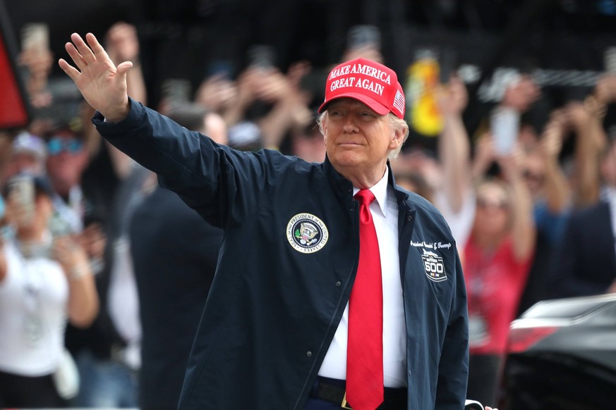 DAYTONA BEACH, FL - FEBRUARY 16: President of the United States Donald J. Trump waves to the crowd prior to the running of the NASCAR, Motorsport, USA Cup Series Daytona 500 on February 16, 2025 at Da ...