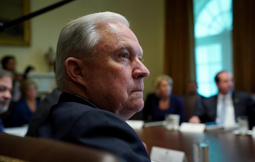 U.S. Attorney General Jeff Sessions listens as President Donald Trump addresses members of his cabinet during a cabinet meeting at the White House in Washington, U.S., August 16, 2018. REUTERS/Kevin L ...