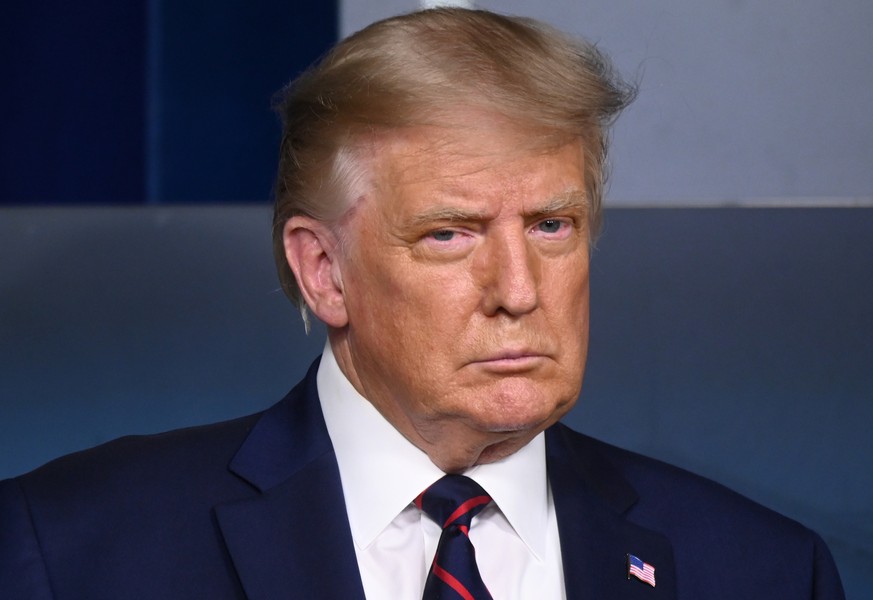 U.S. President Donald Trump attends a news conference about the latest coronavirus disease (COVID-19) developments, in the Brady Press Briefing Room of the White House in Washington, U.S. August 23, 2 ...