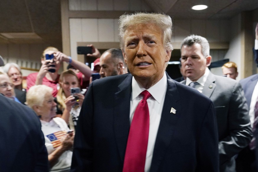 Former President Donald Trump greets supporters before speaking at the Westside Conservative Breakfast, Thursday, June 1, 2023, in Des Moines, Iowa. (AP Photo/Charlie Neibergall)